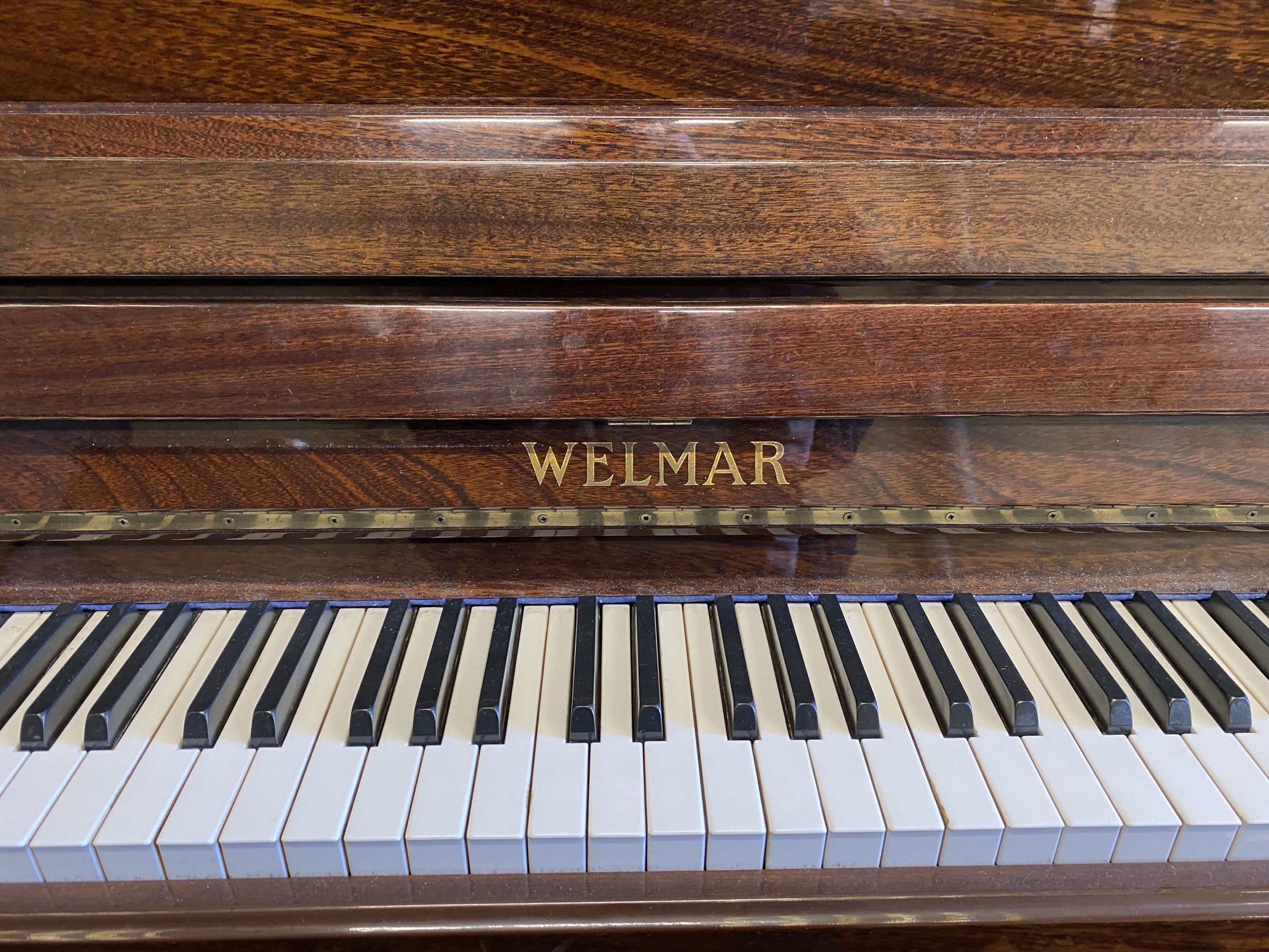 A Welmar mahogany cased upright piano and stool, circa 1986, piano - width 145cm, depth 57cm, height 117cm